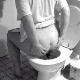 A woman shits into a toilet in this voyeur-like scene. It is supposed to be a hidden camera in the bathroom of the neighbor woman. Funny how she spreads her ass cheeks and sits sideways!